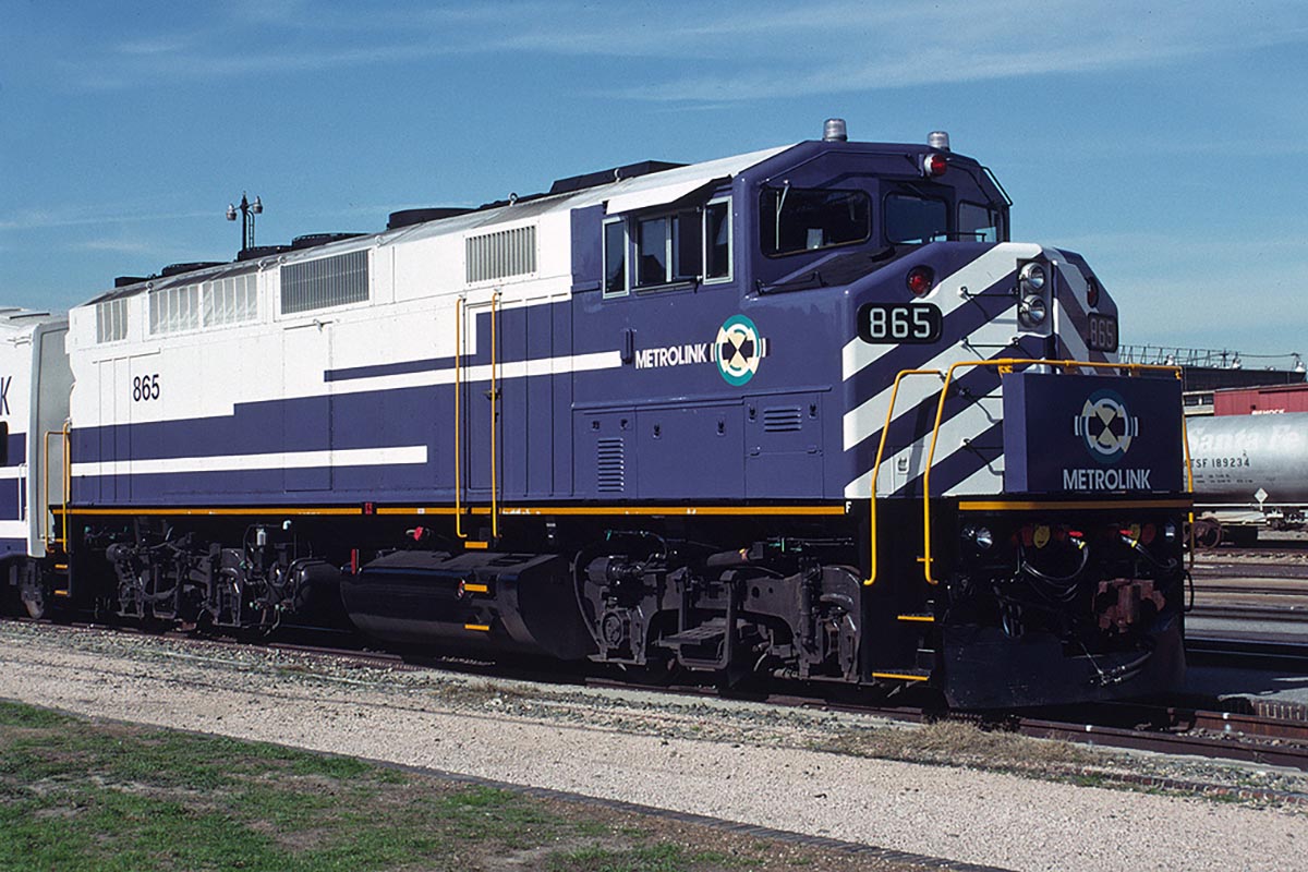 Metrolink 865 sits with its train in San Bernadino, California in January, 1993. Photo by Craig Walker.